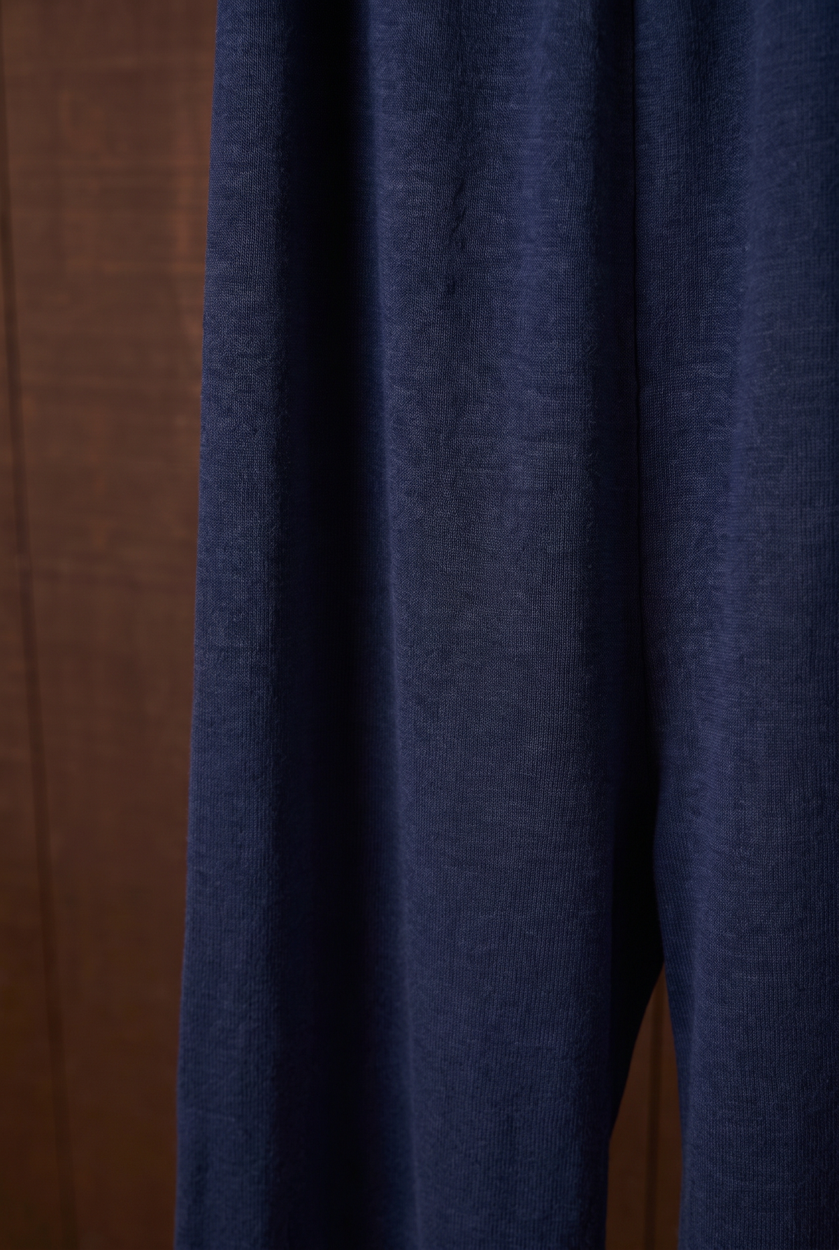 Close-up of indigo merino wool wide-leg pant fabric