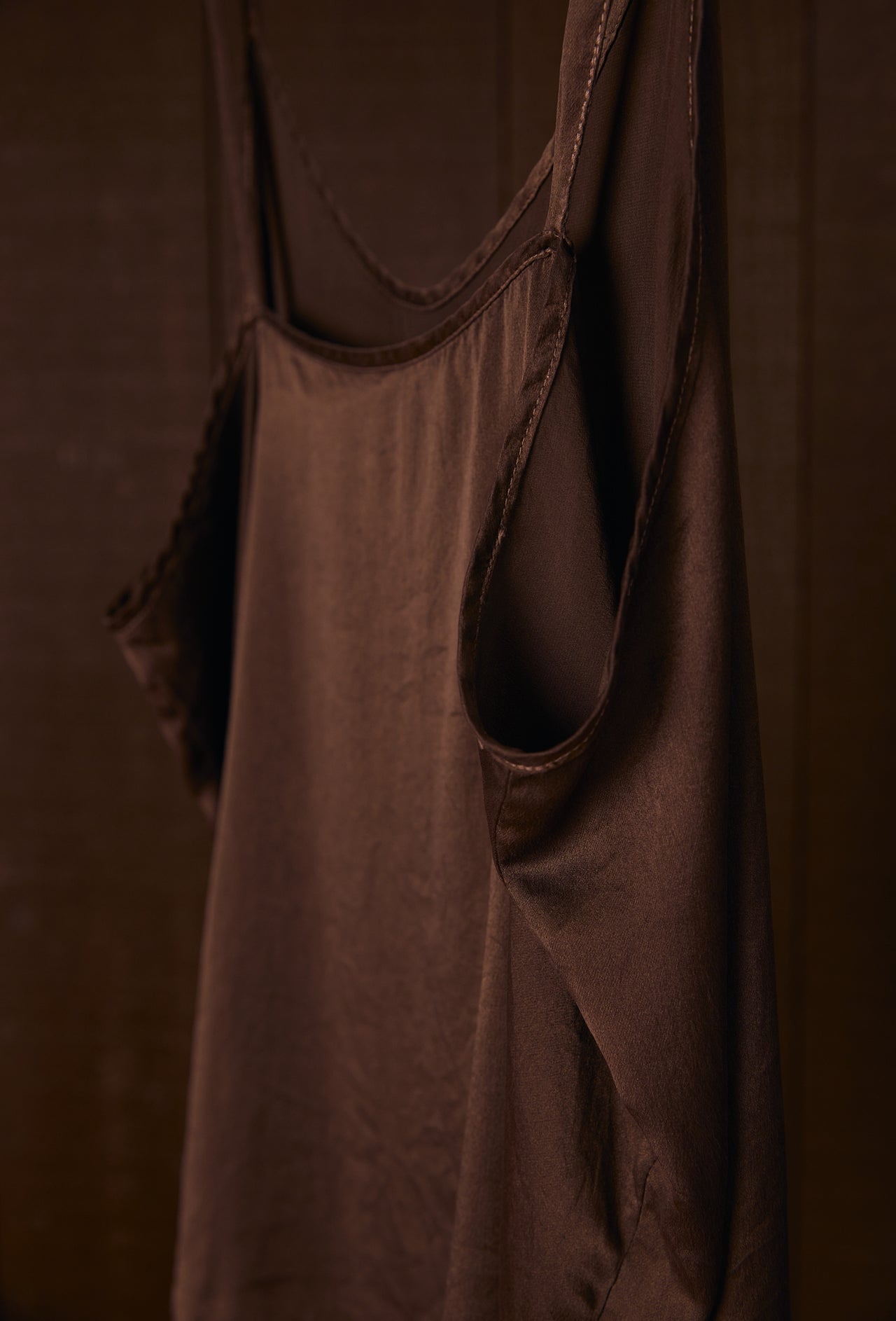 Plant dyed silk camisole on a dark background