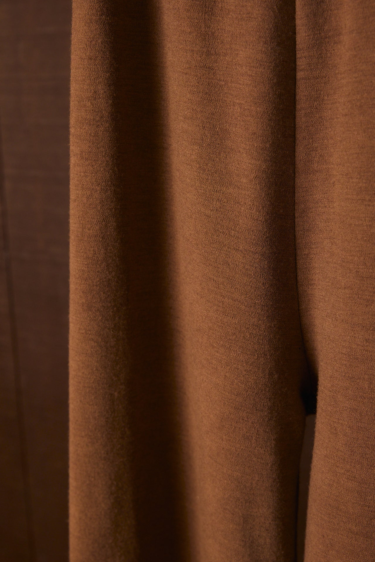 Close-up of brown merino wool fabric with a textured pattern