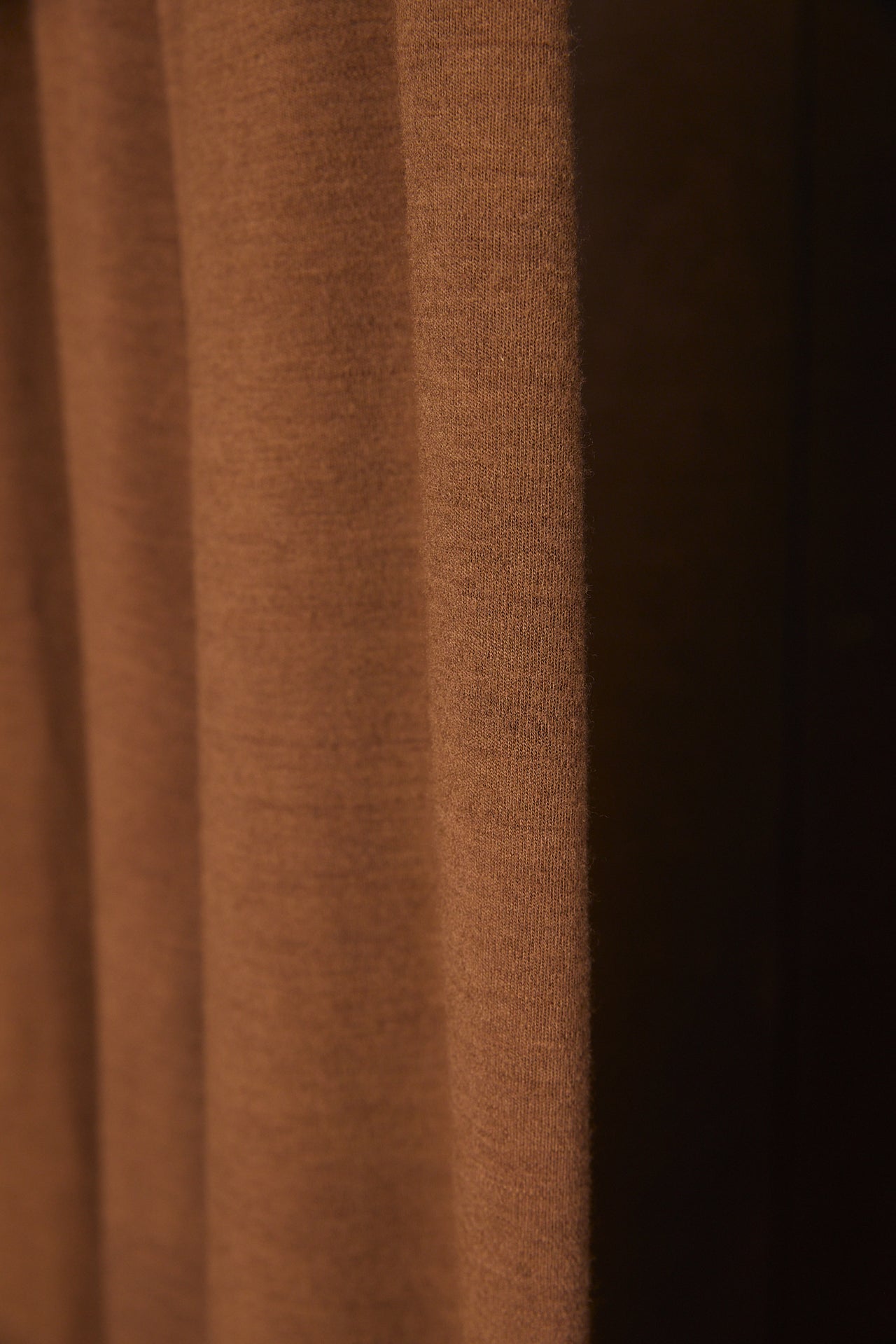 Close-up of brown wool fabric with visible texture