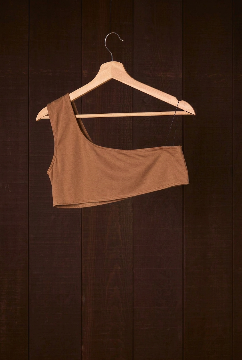 Cutch plant-dyed walnut cotton Una Bra on a wooden hanger, second view