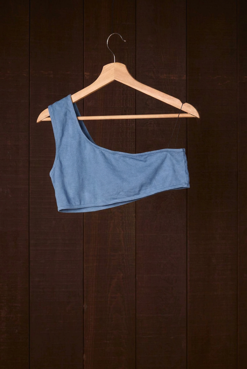 Indigo plant-dyed cotton Una Bra on a wooden hanger, second view