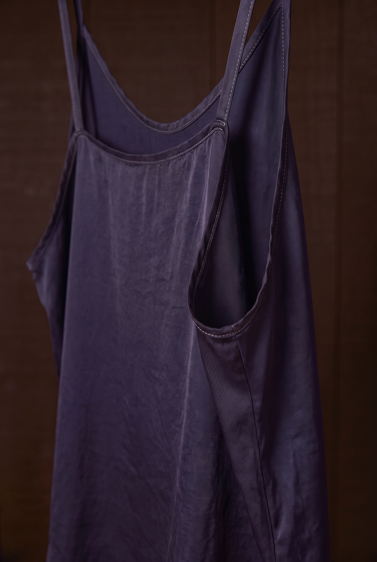 Close-up of indigo silk camisole armhole and back straps